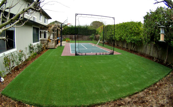Sport court surrounded by artificial grass