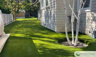 How much water can be saved by installing synthetic grass?